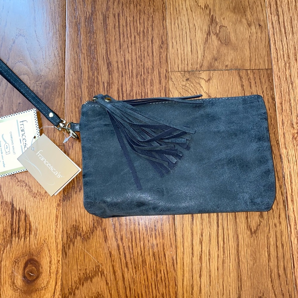 Wristlet hand bag with charger attached